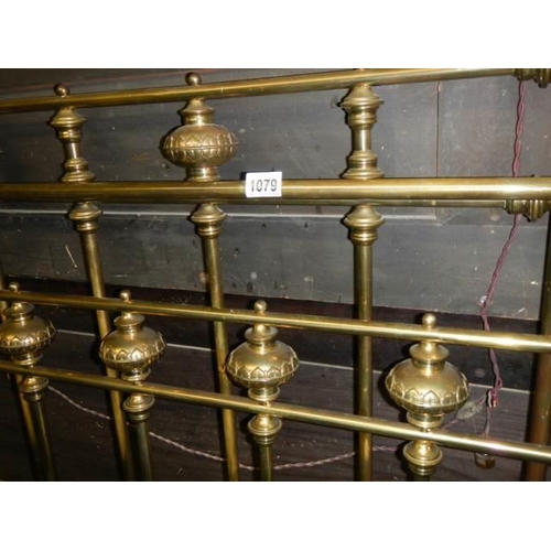 1079 - A good quality brass bedstead with side rails. COLLECT ONLY.