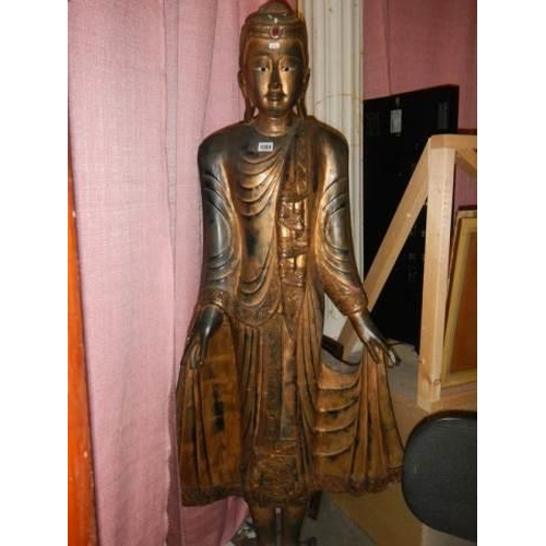 1084 - A carved hardwood figure of an Indian Diety, 5'6