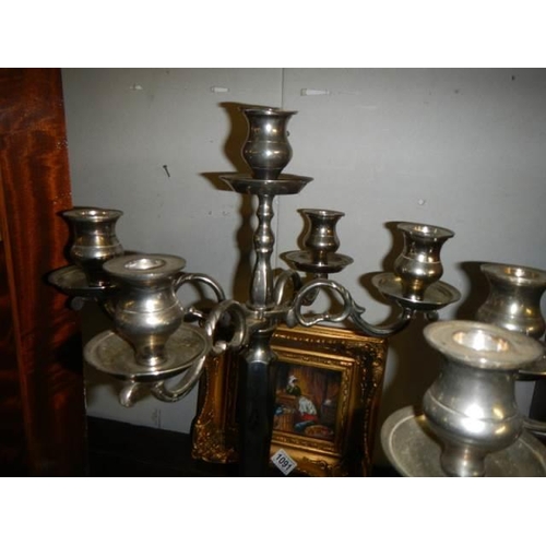 1089 - A pair of silver plate candelabra.