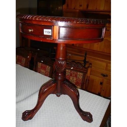 1104 - A mahogany single drawer tripod table. COLLECT ONLY.