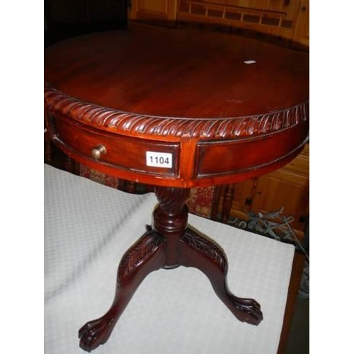 1104 - A mahogany single drawer tripod table. COLLECT ONLY.