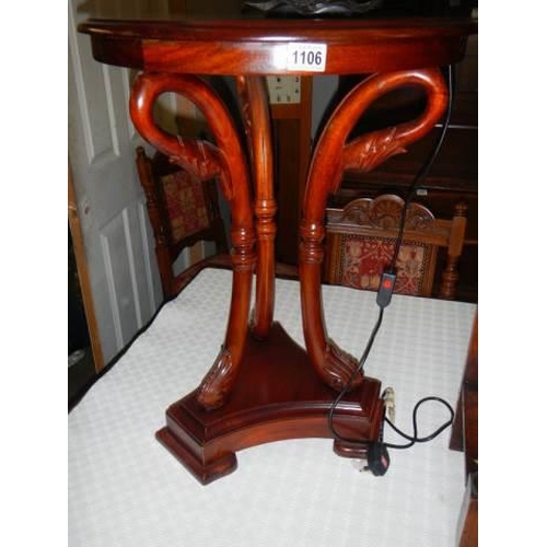 1106 - A mahogany circular side table on splay legs, COLLECT ONLY.