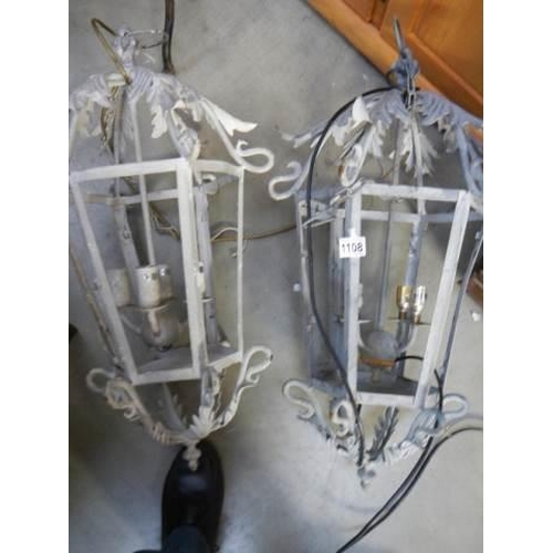 1108 - A pair of wrought iron hanging lanterns, COLLECT ONLY