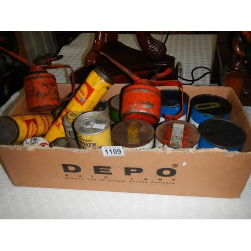 1109 - A box of old advertising oil cans. COLLECT ONLY.