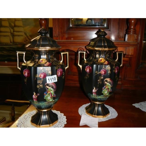 1110 - A pair of early 20th century hand painted vases.