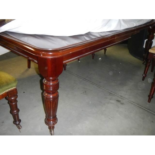 1121 - A Victorian mahogany wind out dining table with eight matching chairs, COLLECT ONLY.