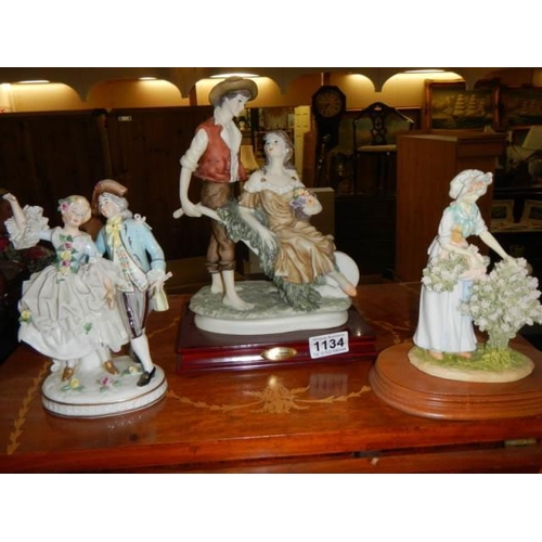 1134 - Three porcelain figures.