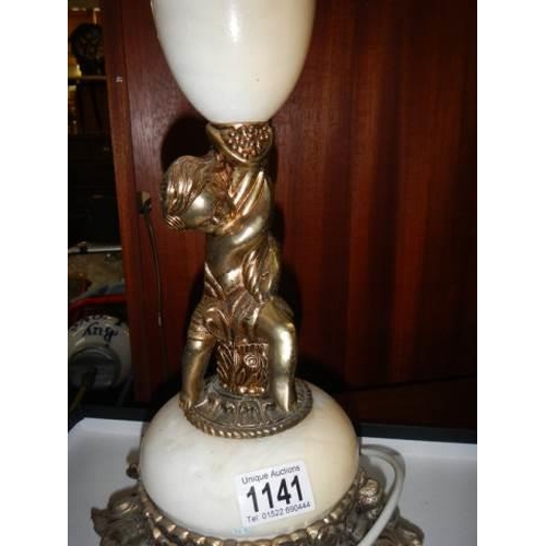 1141 - A circa 1950's heavy marble table lamp with gilded cherub figure. COLLECT ONLY.