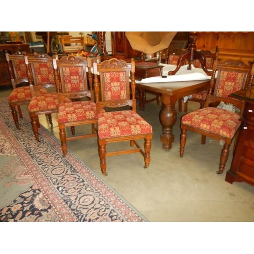 1149 - A large oak wind out table with ten matching chairs, (122cm x 240cm x 72cm high) COLLECT ONLY.