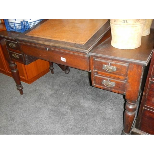 1159 - An early 20th century mahogany desk with sloping top and two drawers, COLLECT ONLY.