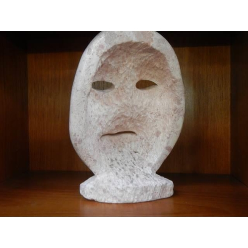 1164 - A carved stone wall mask.