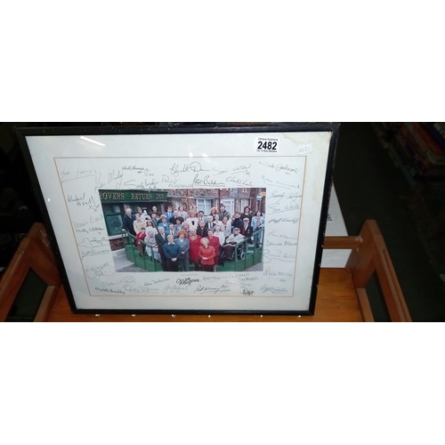 2482 - A 1990's framed and glazed signed picture of the cast from Coronation Street