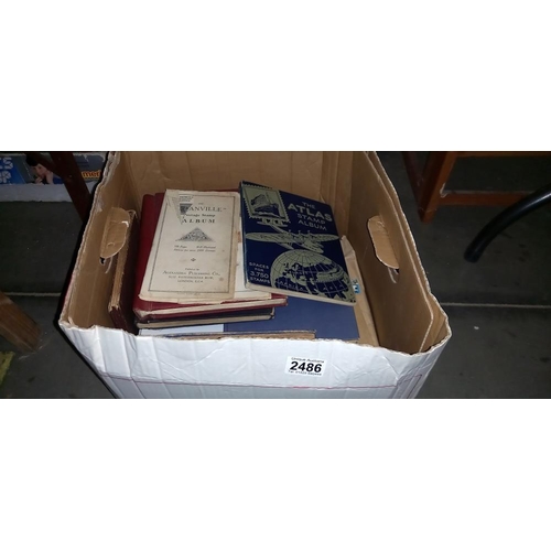 2486 - A box of stamp albums and other stamps