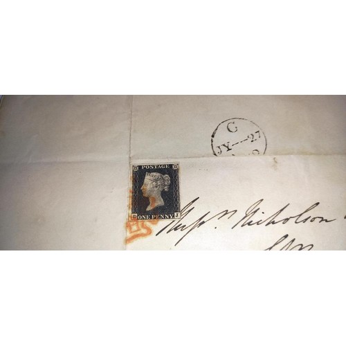 667 - Two mid 19th century penny black postage stamps on postmarked envelopes.