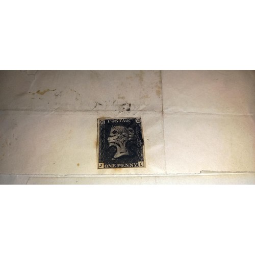 670 - Two mid 19th century penny black postage stamps on postmarked envelopes.