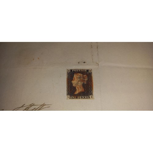 670 - Two mid 19th century penny black postage stamps on postmarked envelopes.