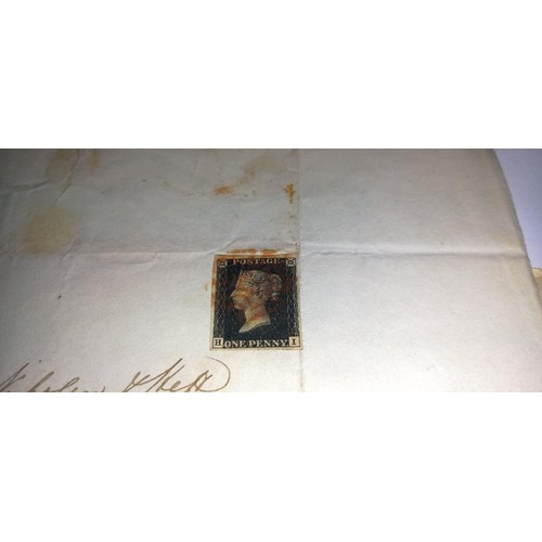 671 - Two mid 19th century penny black postage stamps on postmarked envelopes.