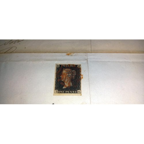 671 - Two mid 19th century penny black postage stamps on postmarked envelopes.