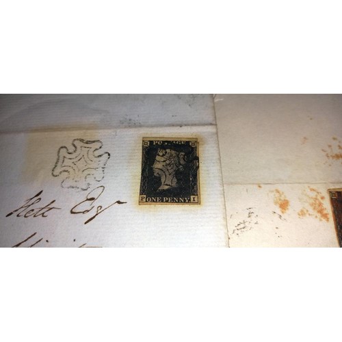 672 - Two mid 19th century penny black postage stamps on postmarked envelopes.