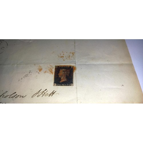 672 - Two mid 19th century penny black postage stamps on postmarked envelopes.