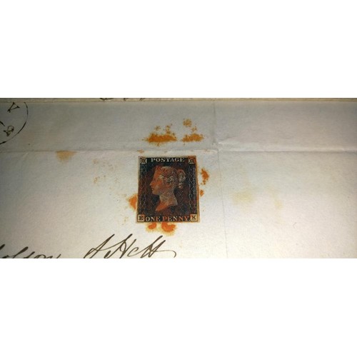 675 - Two mid 19th century penny black postage stamps on postmarked envelopes.