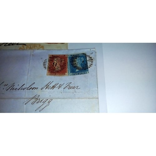 676 - A penny red, a twopenny blue and one other postage stamp on postmarked envelopes.