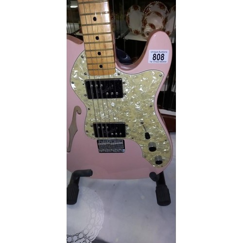 808 - A Fender Telecaster thinline shell pink guitar with black hard case.