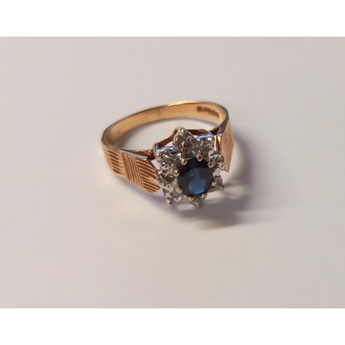 113 - A diamond/sapphire ring dated London 1976, hall marked 9ct, with textured shoulders, size O half, 3.... 