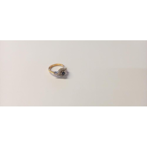 125 - A diamond/sapphire ring set with 17 diamonds and centre sapphire, claw set in 18ct gold, size O, 4.2... 