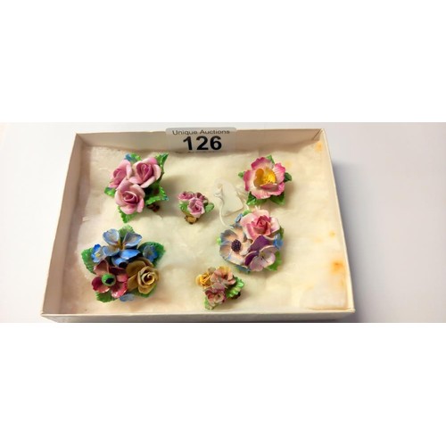 126 - A collection of vintage hand made English china brooches, Coalbrookdale etc., and a pair of earrings... 