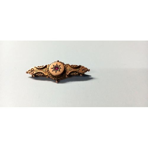 132 - A 19th century ruby/pearl brooch hallmarked for Chester, 9ct. 2.4 grams.