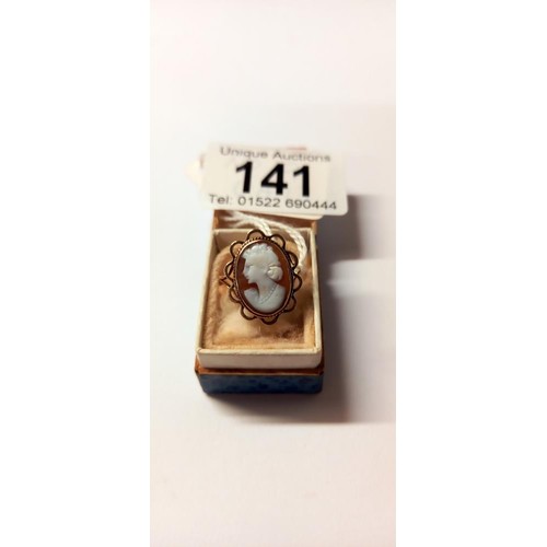 141 - A 9ct gold cameo ring of a female profile dated 1973, HM 9ct, size O, 2.6 grams.