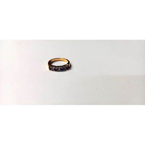 143 - A diamond and tanzanite ring, 18ct gold, HM Birmingham 2005, size L, 4.2 grams.