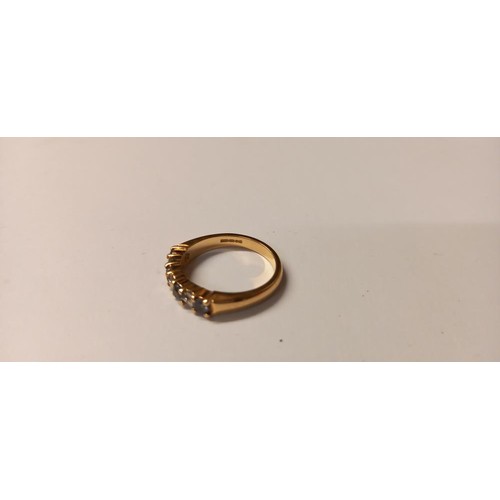 143 - A diamond and tanzanite ring, 18ct gold, HM Birmingham 2005, size L, 4.2 grams.