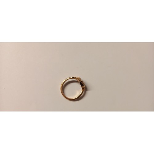 145 - A lovely diamond chip set heart ring in gold, size O, 2.8 grams. (Unmarked)