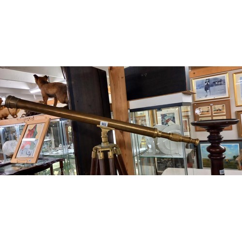 902 - A 100cm brass telescope on brass bound mahogany tripod stand.