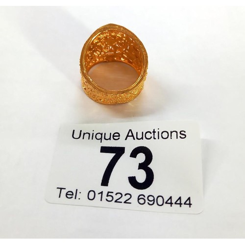 73 - An ornate 22ct gold ladies ring, size N, 7 grams.