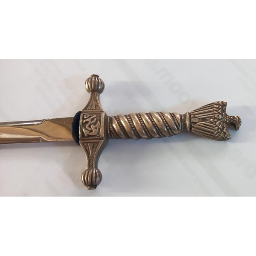 243 - A cased letter opener in the form of a dagger with eagle feature.