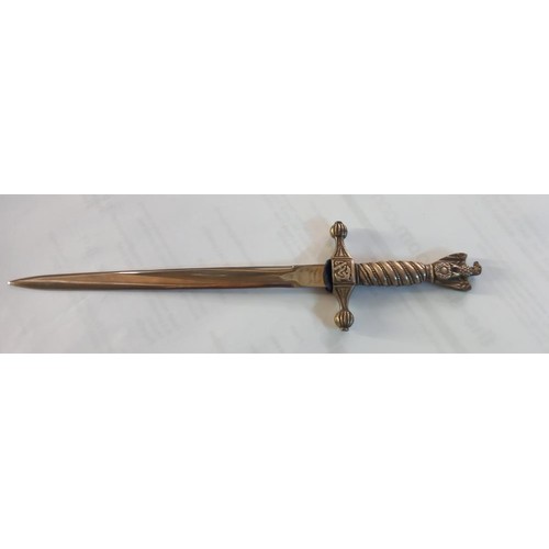 243 - A cased letter opener in the form of a dagger with eagle feature.