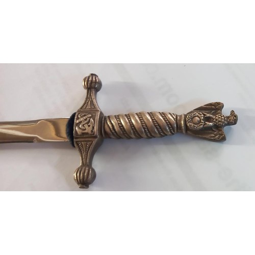 243 - A cased letter opener in the form of a dagger with eagle feature.