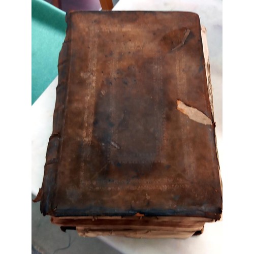 523 - An early 18th century Bible, some pages need attention but in fair condition for age.