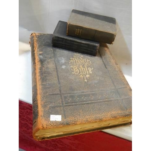 13 - A large old Bible and two smaller examples.