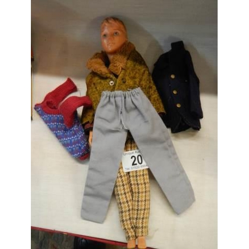 20 - A Sindy male doll 'Paul' with clothing including Motorway Man outfit, winter jersey, London look jac... 
