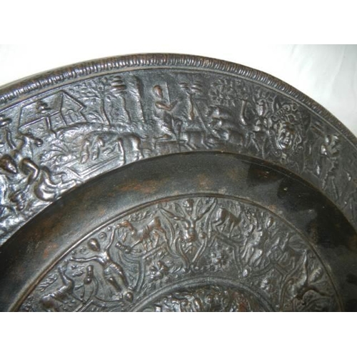 31 - A large cast metal copy of an 18th century charger.