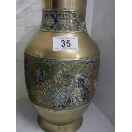 35 - A pair of Chinese vases with cloissonne style decoration.