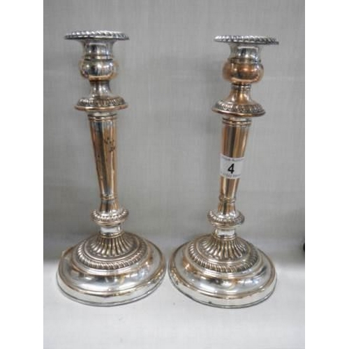 4 - A pair of Sheffield plate candlesticks.