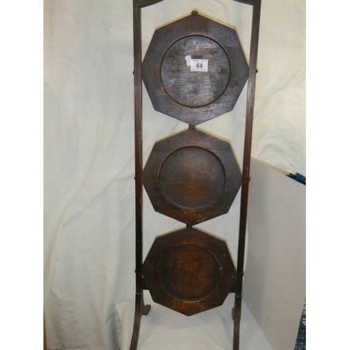 44 - A three shelf oak folding cake stand, COLLECT ONLY.