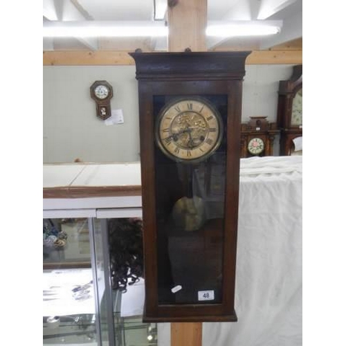 48 - A mahogany wall clock, spring good and works but doesn't chime. COLLECT ONLY.