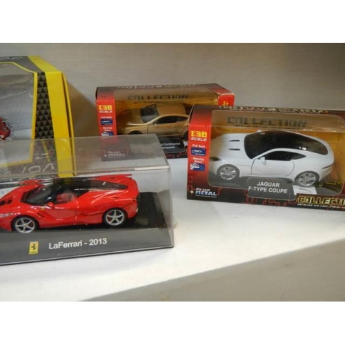 9 - Five boxed and one unboxed die cast vehicles.