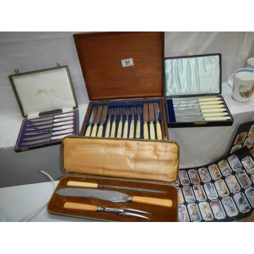 51 - Four cased cutlery sets including carving set.